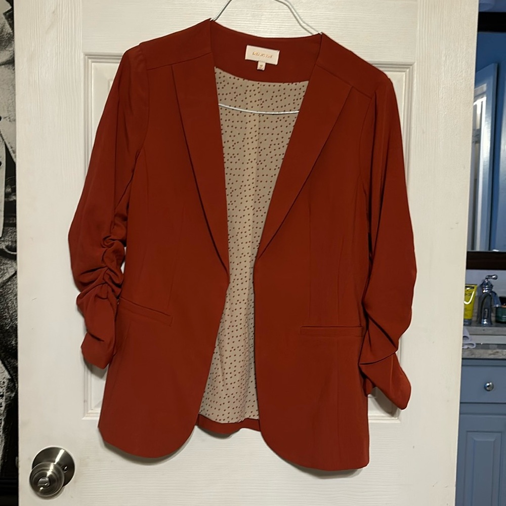 Like new women’s orange medium blazer.